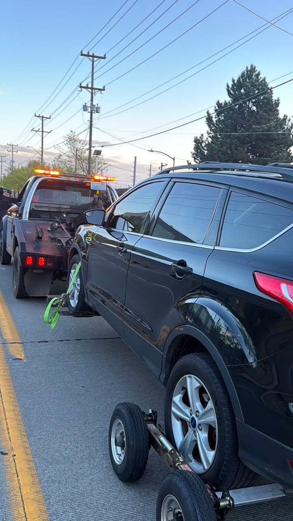 A1 Seattle Towing family owned team towing a vehicle in Seattle, WA